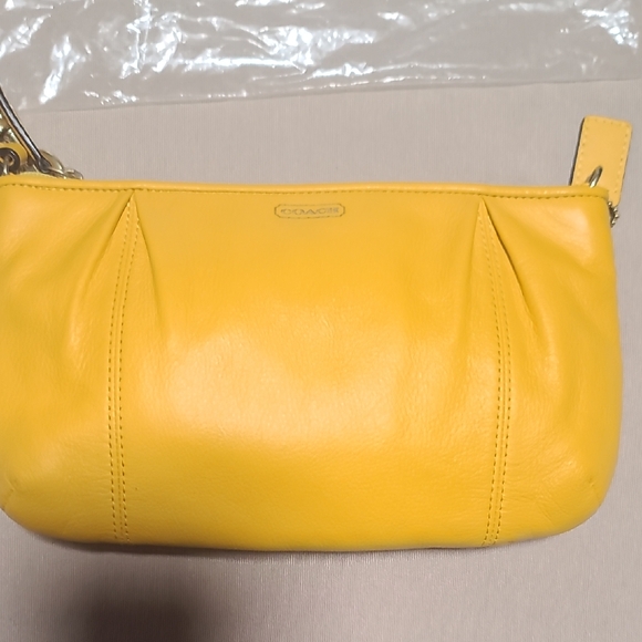 Coach Handbags - Coach Vibrant Yellow Leather Clutch